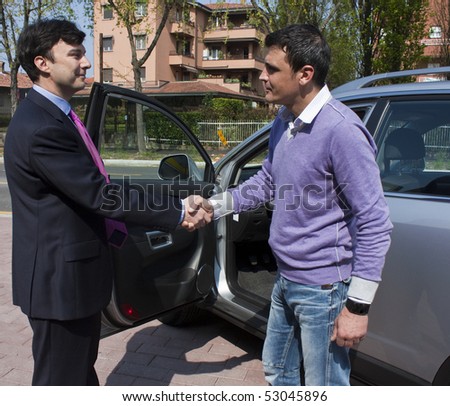 Handshake between customer and car salesperson