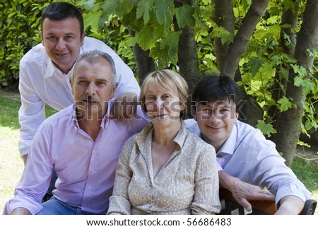 Parents and Sons posing for Family Portrait in the Garden