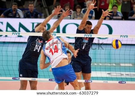 ROME, ITALY - OCTOBER 10: Serbia Ivan Miljkovic spikes ball at Volleyball World Championships bronze medal match Italy vs Serbia at Palalottomatica in Rome on October 10, 2010