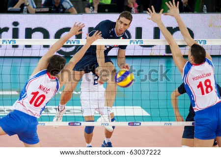 ROME, ITALY - OCTOBER 10: Italy Simone Parodi spikes ball at Volleyball World Championships bronze medal match Italy vs Serbia at Palalottomatica in Rome on October 10, 2010