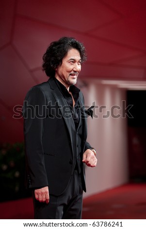 VENICE, ITALY - SEPTEMBER 9: actor Koji Yakusho on red carpet for movie premiere of  \
