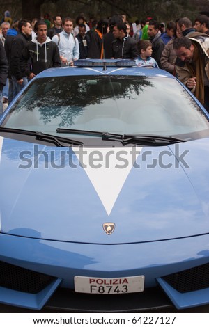 LUCCA, ITALY - OCTOBER 30: visitors look at Police Lamborghini at Lucca Comics and Games 2010 fair on October 30, 2010 in Lucca, Italy.