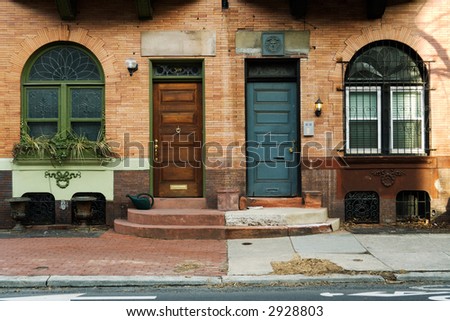 Near symmetry between two front doors, side by side.  Philadelphia, PA.