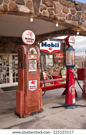COOL SPRINGS, AZ, USA - DECEMBER 30:Old time gas pumps outside a restored service station on Route 66 in Arizona are reminders of the early days of U.S. auto travel. Photo taken Dec. 30, 2012.