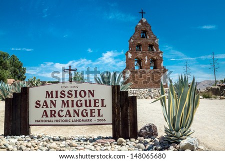 The sign and campanario at Mission San Miguel Arcangel in San Miguel, California along the historic mission trail.