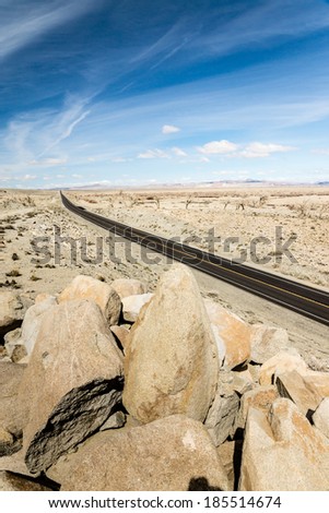 A modern highway stretches across the ancient landscape in Nevada\'s Great Basin.