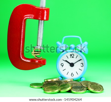 A Gold Euro Symbol in a red vice, with a blue clock resting on some gold coins, asking the question how far will the Euro be squeezed.