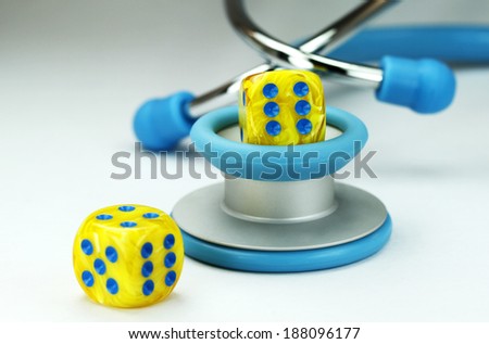 Health, health care, medical tool, dice, red dice, gamble, two dice, medical, rolled dice, yellow dice, blue spots, conceptual, stethoscope, light blue stethoscope,