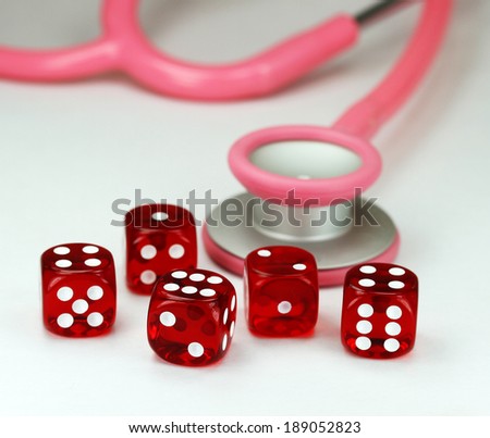 Five red translucent dice with white dots on them in front of a pink stethoscope, asking the question do you gamble with your health?
