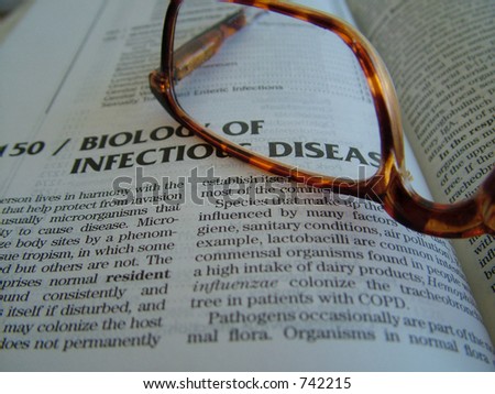 Medical book and glasses