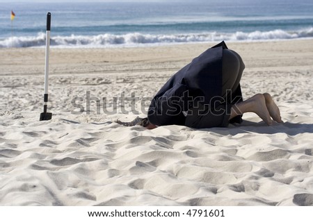 stock-photo-businessman-doing-his-up-most-to-avoid-the-business-day-by-burying-his-head-in-the-sand-4791601.jpg