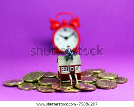 A real estate agent, on top of a small house with gold coins scattered around and red alarm clock in the pastel purple bank ground, asking the question wake up to your debt!