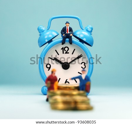 A couple walking up a golden coin stairway, with the bank manager ahead of them sat on a pastel blue alarm clock, asking the question, can you last the financial journey.