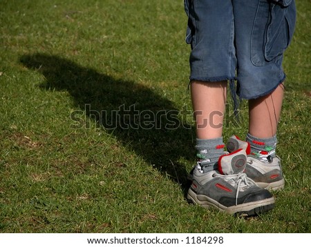 stock photo young girls legs and feet in sneakers in a funny position