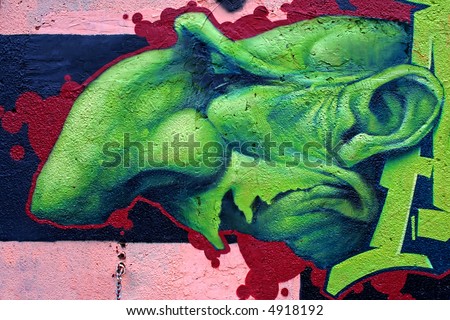 abstract graffiti painting, green ugly face with a huge nose