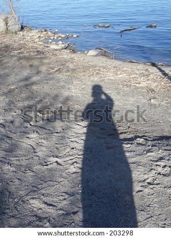 Shadow of a person with a biking helmet on
