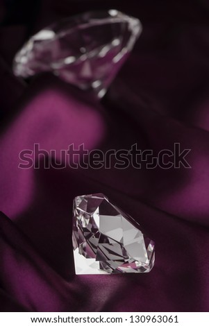Expensive Translucent Diamonds over Purple Silk Fabric