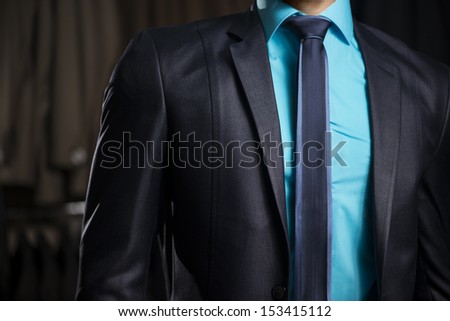 Man in Elegant Business Man Suit at Men Fashion Shop