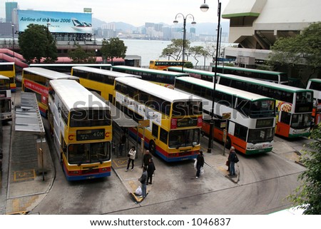 Double decker buses at a bus terminal in Hong Kong.