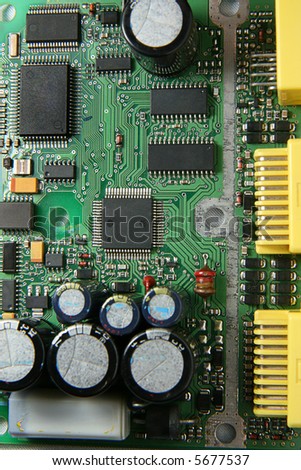 A printed circuit board with various electronic devices mounted on it.