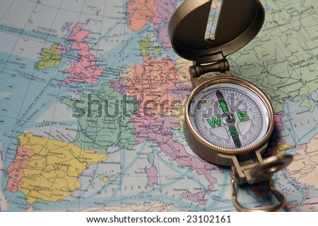 A compass on the map of the European continent.