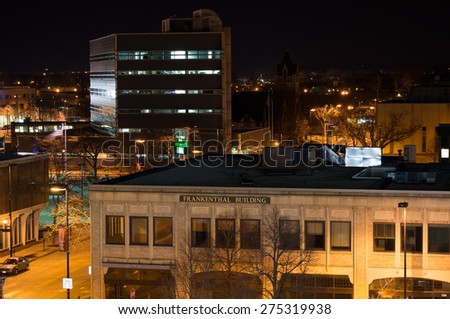 Green Bay, Wisconsin - March 9:  Downtown Green Bay view from parking structure shows a couple of buildings and streets illuminated on March 9, 2015.