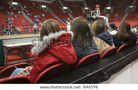 Fans watching a college basketball game