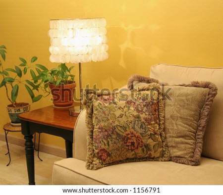 Pillows and shell lamp featured