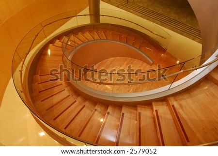 Modern glass an wooden spiral staircase