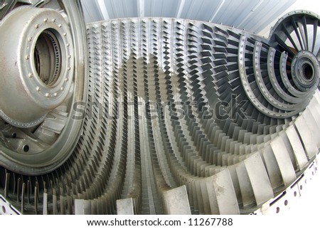 Fish-eye view of internal parts of a jet engine left outdoors