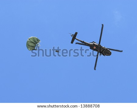 National Guard soldier jumping out from a Blackhawk helicopter