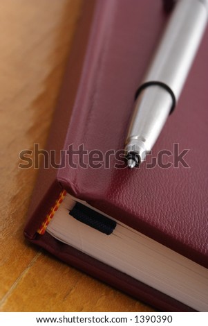 Still-life of pen on notebook
