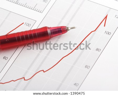 pen on positive earning chart(focus on the tip of the pen)