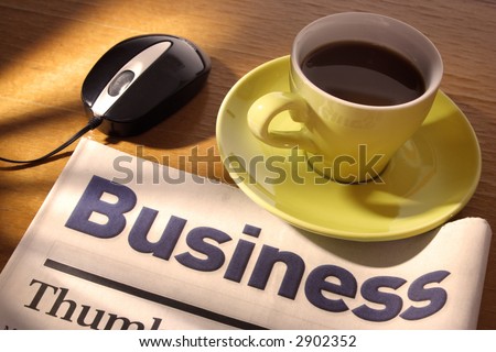 Coffee, Newspaper and Mouse on Desk