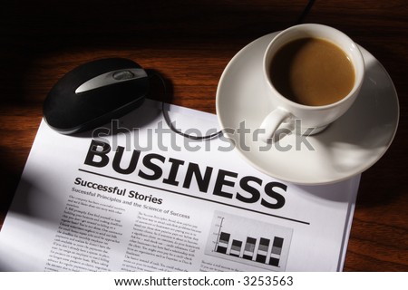 Still life of coffee, mouse and business file on table