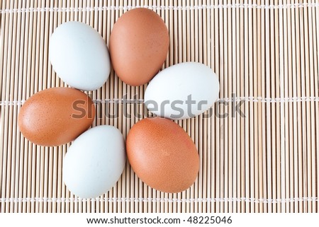 composition of six brown and pale green eggs