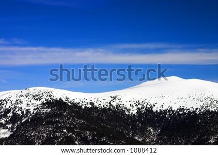 Winter simple landscape with snow-covered mountains
