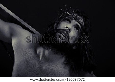 Jesus close up black and white holding the cross on his back