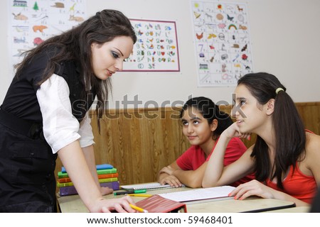 Teacher helping the students to get the answer right