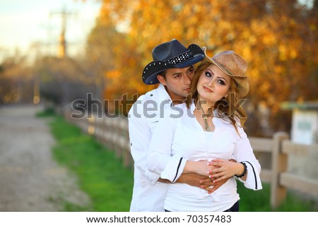 Cowboy and his cowgirl hugging each other