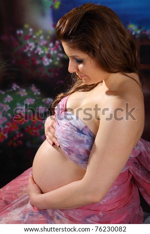 Over the shoulder view of a pregnant woman