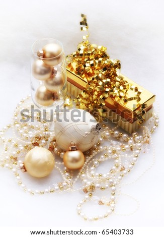 Gold and white present, ornaments and garland