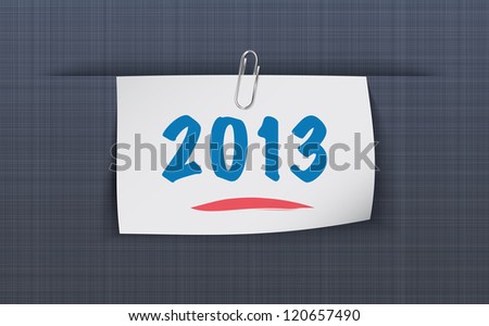 2013 on sticky note attached to the linen background with paper clip