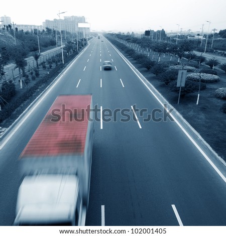 Highway with truck and cars. motion blur