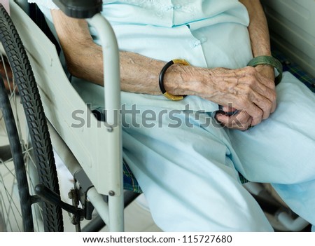 old woman on a wheelchair.