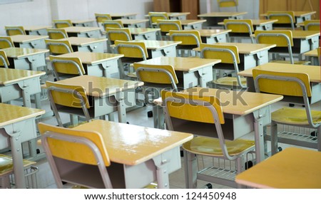 Desk And Chairs In Classroom.