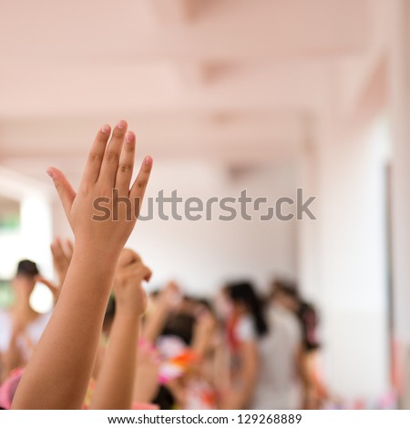 happy children with their hands up