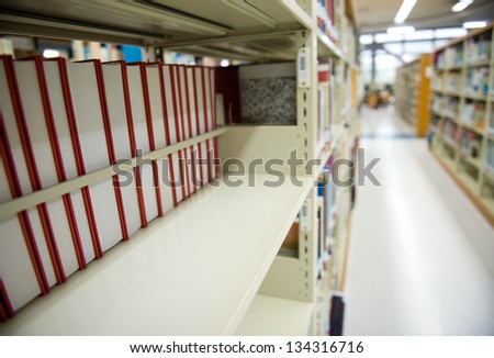 Interior of library with book shelves and books.