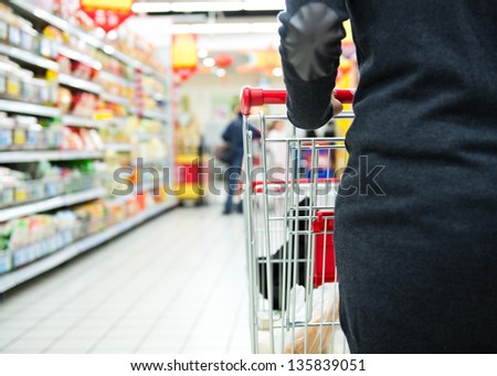 Closeup Of Woman With Shopping Cart.