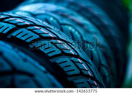 Group of  new tires for sale at a tire store. selective focus.